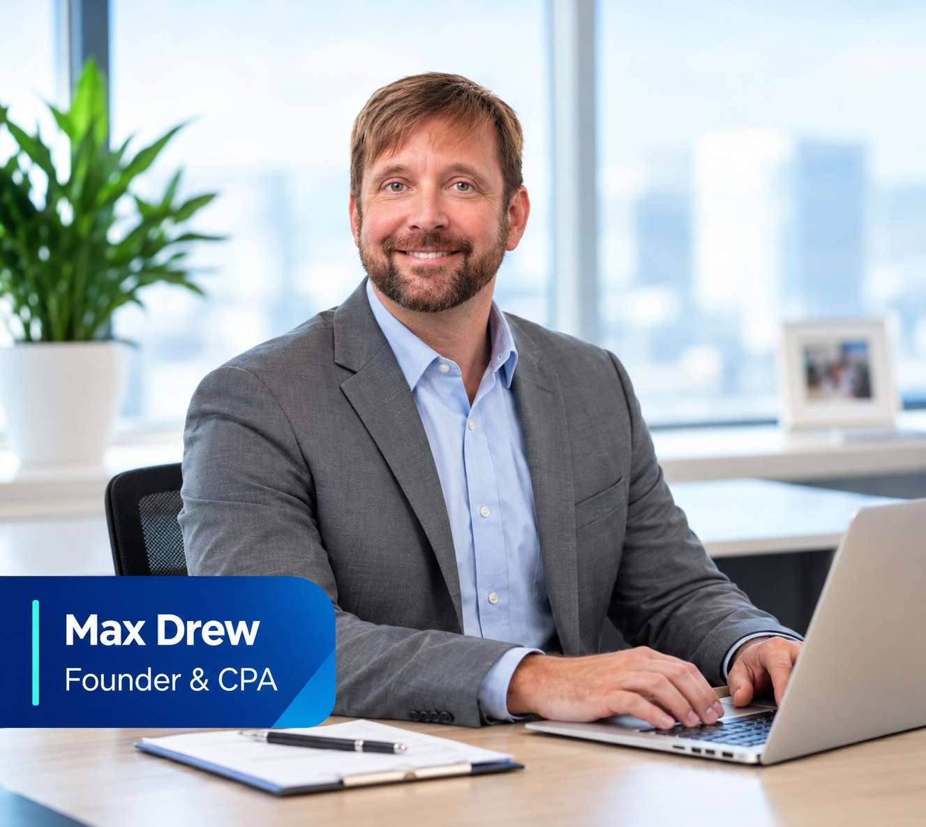 Max Drew, Founder and CPA of Magnum CPA PC, smiling at his desk